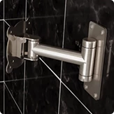 Aluminum swivel bracket BR-100 for a bathroom smart touch TV on a black tiled wall.