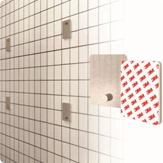 Ocea Pro Bathroom TV drill-free wall-mount system on a white tiled wall shower room.