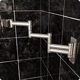 Bathroom TV Ocea Pro aluminum swivel bracket BR-140 on a black porcelain tiled wall.